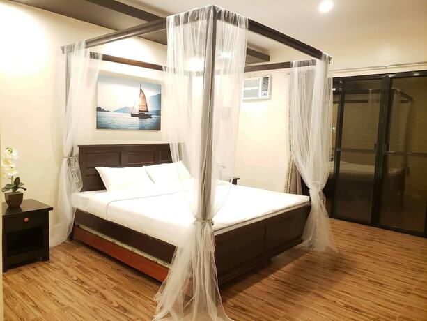 Imagen de la habitación del Hotel AandA Garden Suites. Foto 19