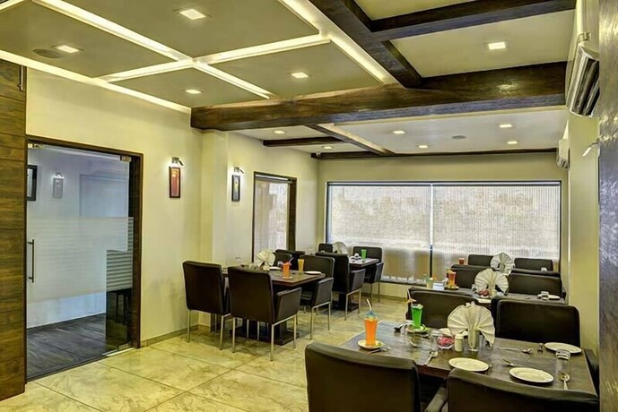 Imagen del bar/restaurante del Hotel Aaram Orchard. Foto 13