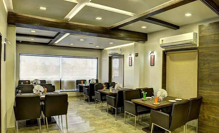 Imagen del bar/restaurante del Hotel Aaram Orchard. Foto 14