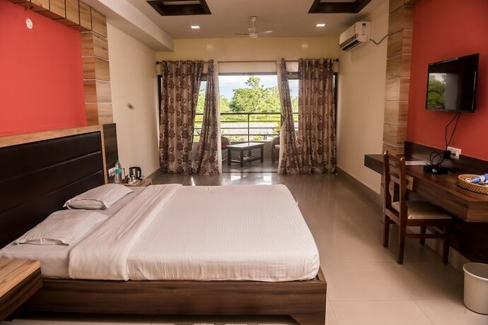 Imagen de la habitación del Hotel Aatreyee. Foto 17