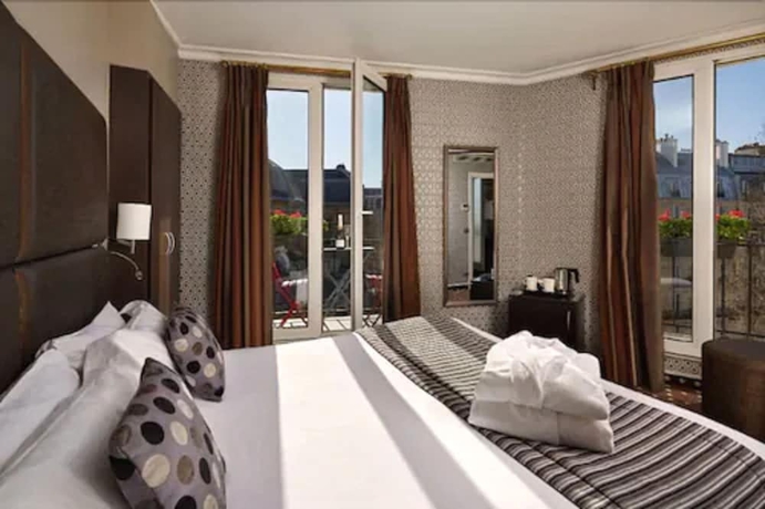 Imagen de la habitación del Hotel Abbatial Saint Germain. Foto 11