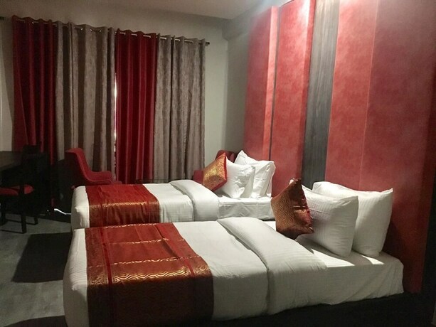 Imagen de la habitación del Hotel Abhinav International. Foto 26