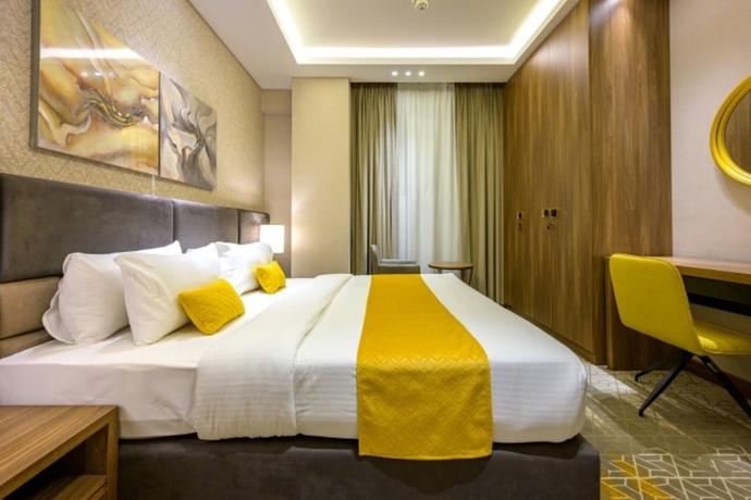 Imagen de la habitación del Hotel Abraj INN Suites hotel. Foto 3