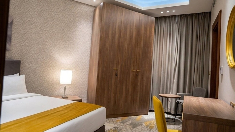 Imagen de la habitación del Hotel Abraj INN Suites hotel. Foto 7