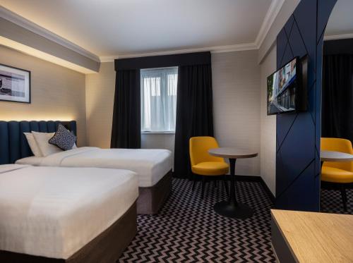 Imagen de la habitación del Hotel Academy Plaza. Foto 2