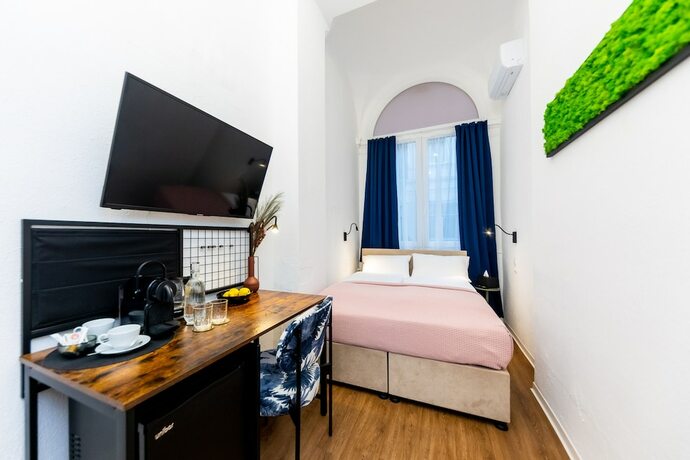 Imagen de la habitación del Hotel Adagio Downtown Rooms. Foto 16