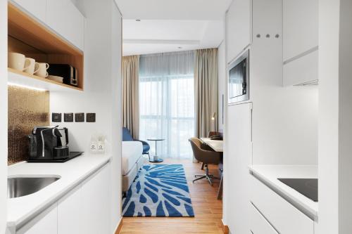 Imagen de la habitación del Hotel Adagio Premium The Palm. Foto 11