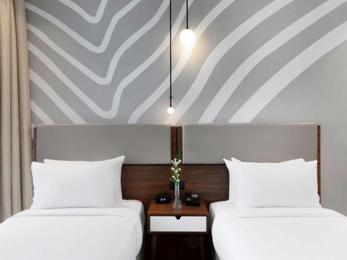 Imagen de la habitación del Hotel Adagio Premium The Palm. Foto 15