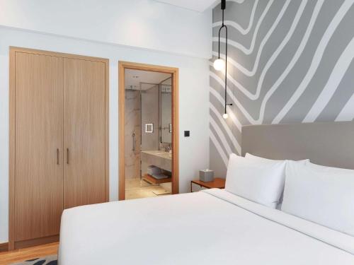 Imagen de la habitación del Hotel Adagio Premium The Palm. Foto 17