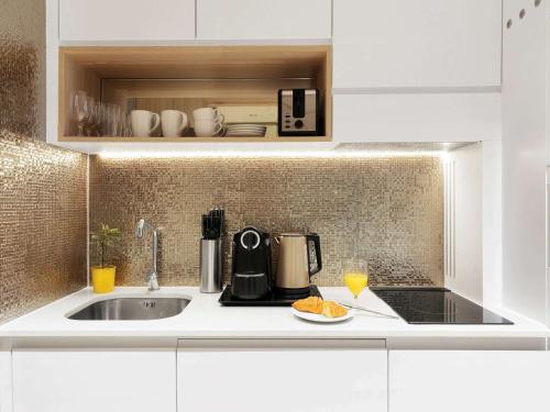 Imagen general del Hotel Adagio Premium The Palm. Foto 3