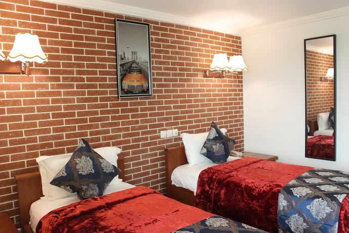 Imagen de la habitación del Hotel Adamaoua Grand Hotel. Foto 4