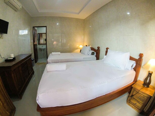 Imagen de la habitación del Hotel Adi Homestay Canggu. Foto 19