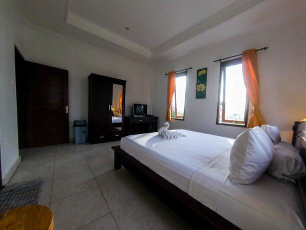 Imagen de la habitación del Hotel Adi Homestay Canggu. Foto 21