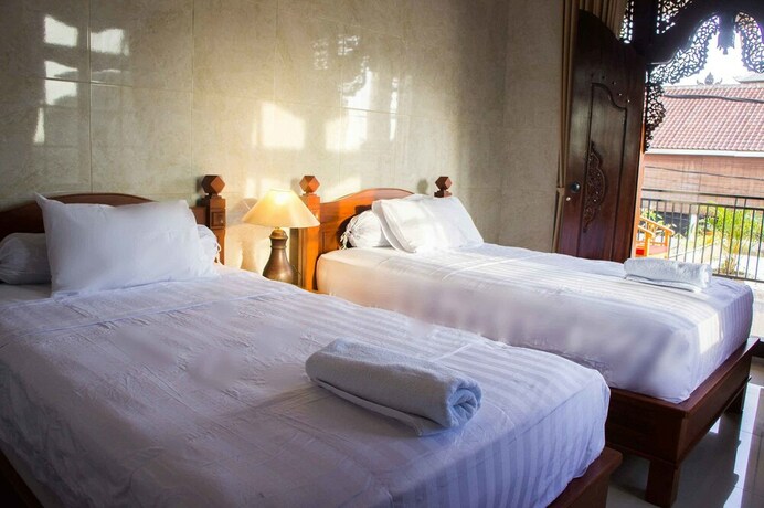 Imagen de la habitación del Hotel Adi Homestay Canggu. Foto 22