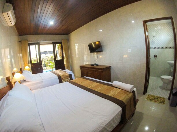 Imagen de la habitación del Hotel Adi Homestay Canggu. Foto 25