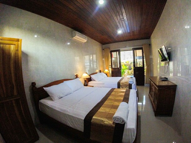 Imagen de la habitación del Hotel Adi Homestay Canggu. Foto 32