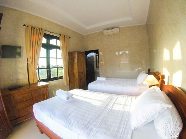 Imagen de la habitación del Hotel Adi Homestay Canggu. Foto 35