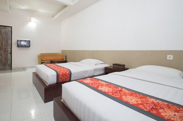 Imagen de la habitación del Hotel Adikara Renon. Foto 25