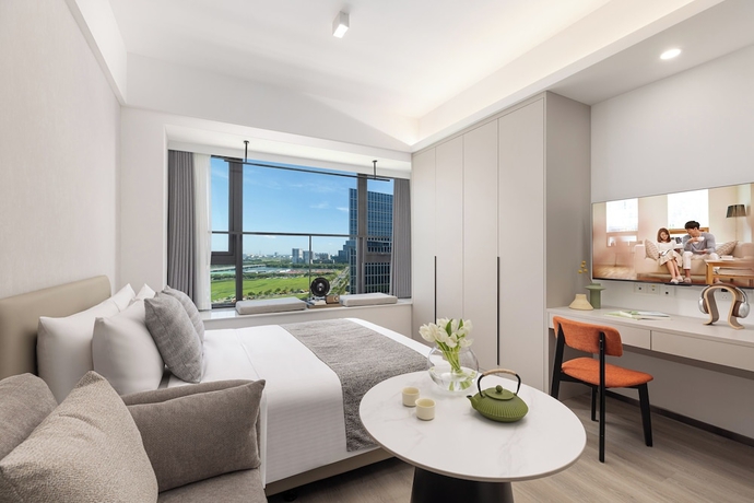 Imagen de la habitación del Hotel Adoor Suites Songbei Suzhou. Foto 2