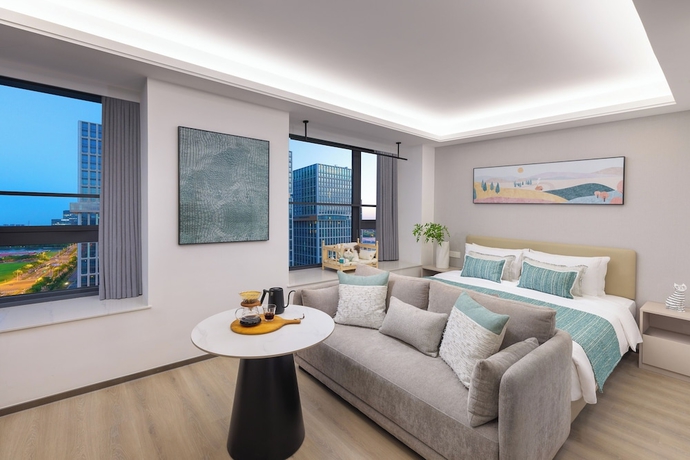 Imagen de la habitación del Hotel Adoor Suites Songbei Suzhou. Foto 6