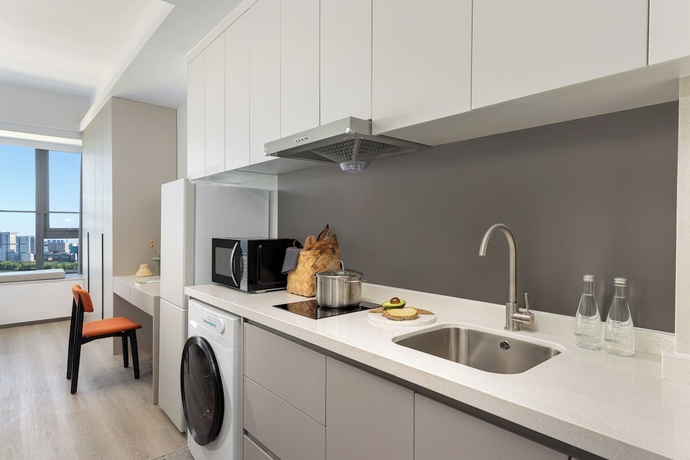 Imagen de la habitación del Hotel Adoor Suites Songbei Suzhou. Foto 10