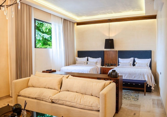 Imagen de la habitación del Hotel Adoro Boutique. Foto 9