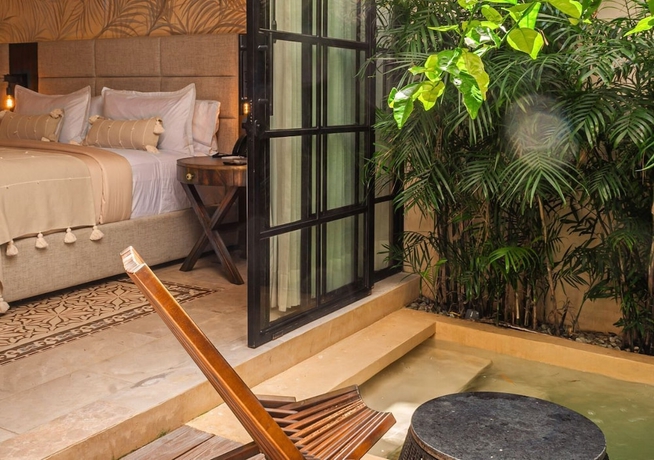 Imagen de la habitación del Hotel Adoro Boutique. Foto 11