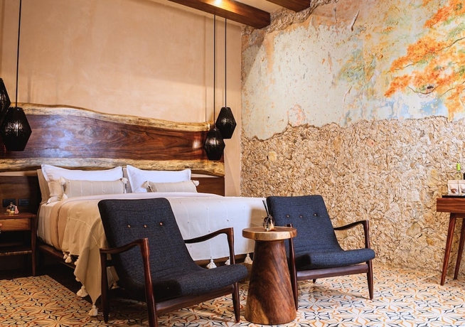 Imagen de la habitación del Hotel Adoro Boutique. Foto 14