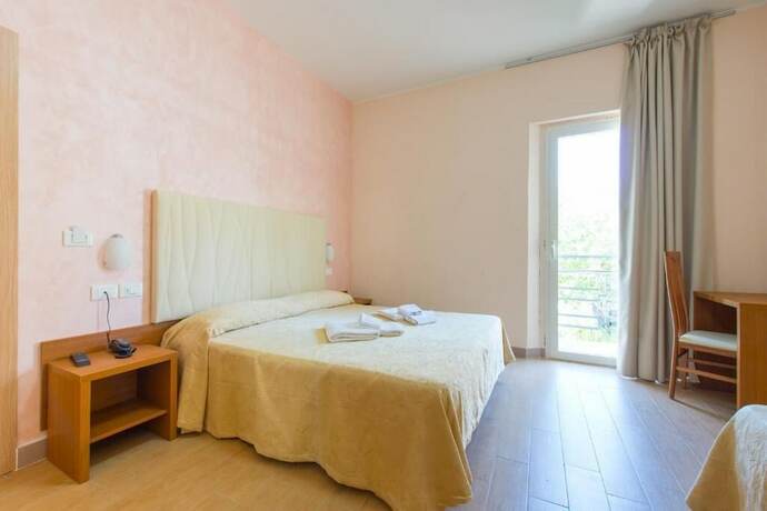 Imagen de la habitación del Hotel Adria Nuova. Foto 9
