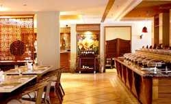 Imagen del bar/restaurante del Hotel Aegean Boutique Suites Resort Sanya. Foto 2