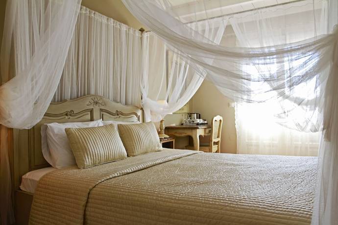 Imagen de la habitación del Hotel Aegean Village Beachfront Resort. Foto 9