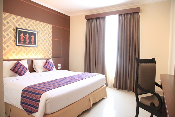 Imagen de la habitación del Hotel Aerotel Smile Makassar. Foto 4