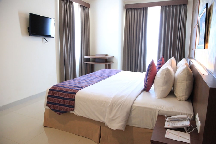 Imagen de la habitación del Hotel Aerotel Smile Makassar. Foto 9