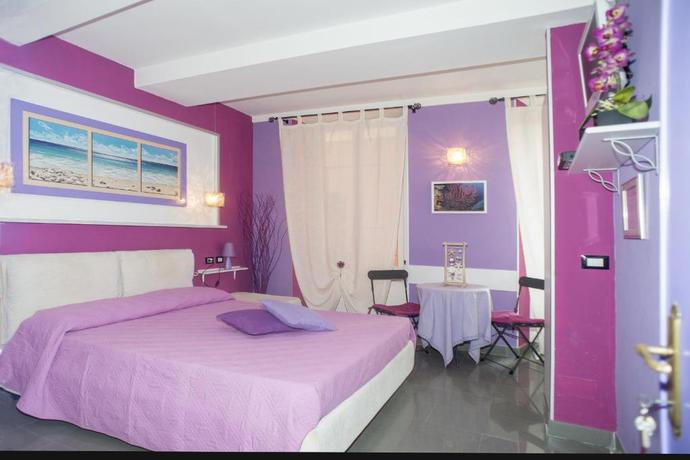 Imagen de la habitación del Hotel Affittacamere I Coralli. Foto 11