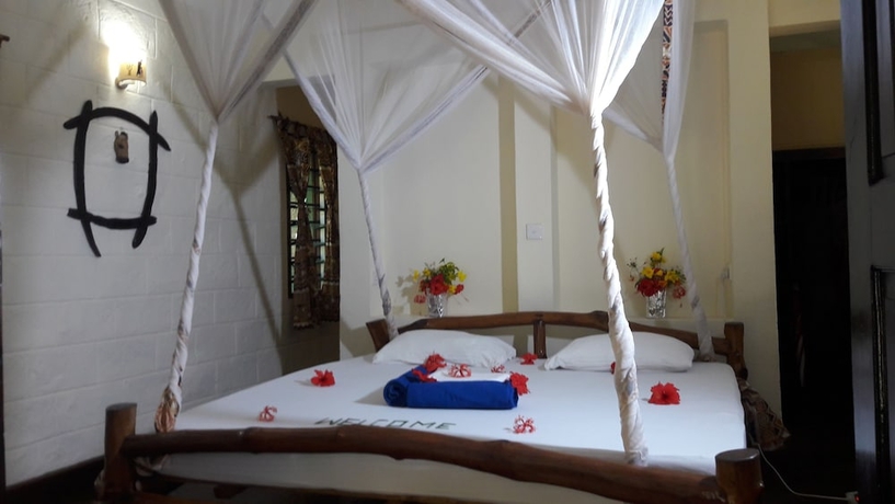 Imagen de la habitación del Hotel African Dream Cottages. Foto 2