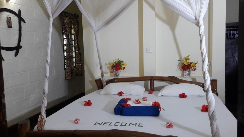 Imagen de la habitación del Hotel African Dream Cottages. Foto 11