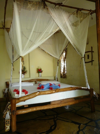 Imagen de la habitación del Hotel African Dream Cottages. Foto 12