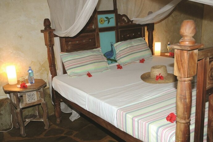 Imagen de la habitación del Hotel Afrika Pearl and Spa. Foto 14