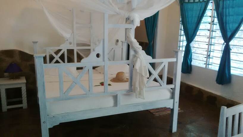 Imagen de la habitación del Hotel Afrika Pearl and Spa. Foto 17