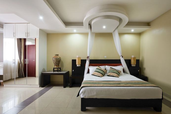 Imagen de la habitación del Hotel Afrique Suites. Foto 15