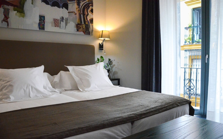 Imagen de la habitación del Hotel Aguilas5 Sevillasuites. Foto 2