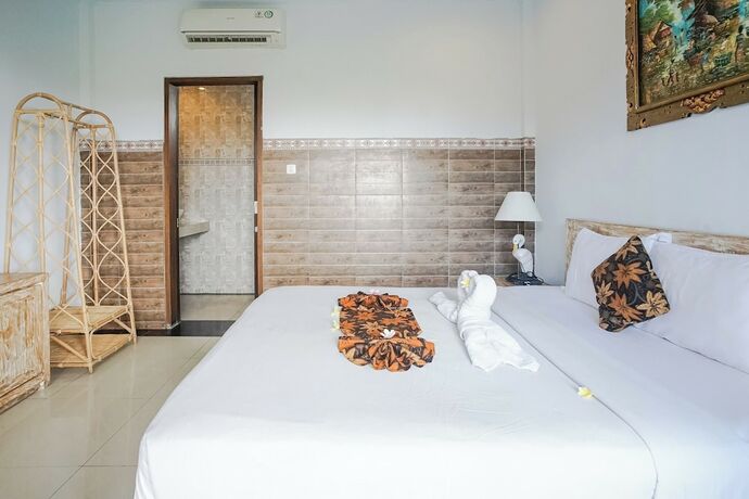 Imagen de la habitación del Hotel Agung Homestay Canggu. Foto 30