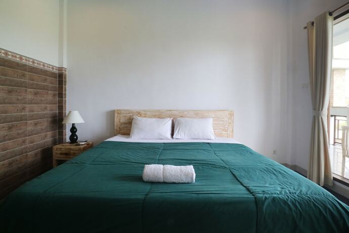 Imagen de la habitación del Hotel Agung Homestay Canggu. Foto 32