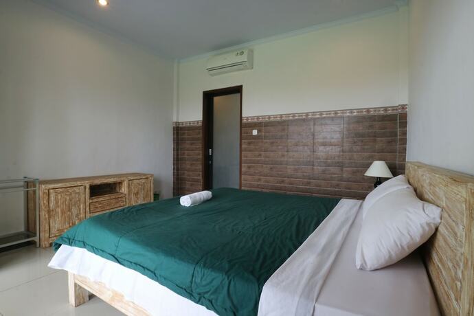 Imagen de la habitación del Hotel Agung Homestay Canggu. Foto 33