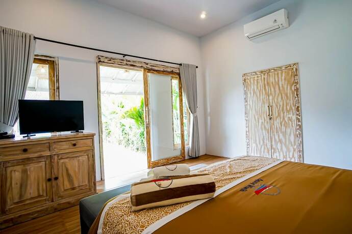 Imagen de la habitación del Hotel Agung Wiwin Homestay. Foto 16