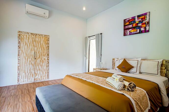 Imagen de la habitación del Hotel Agung Wiwin Homestay. Foto 17