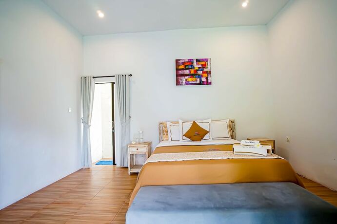 Imagen de la habitación del Hotel Agung Wiwin Homestay. Foto 21