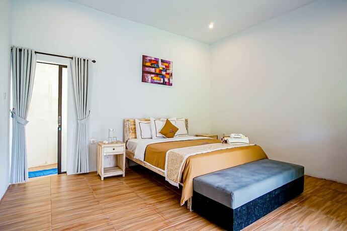 Imagen de la habitación del Hotel Agung Wiwin Homestay. Foto 23