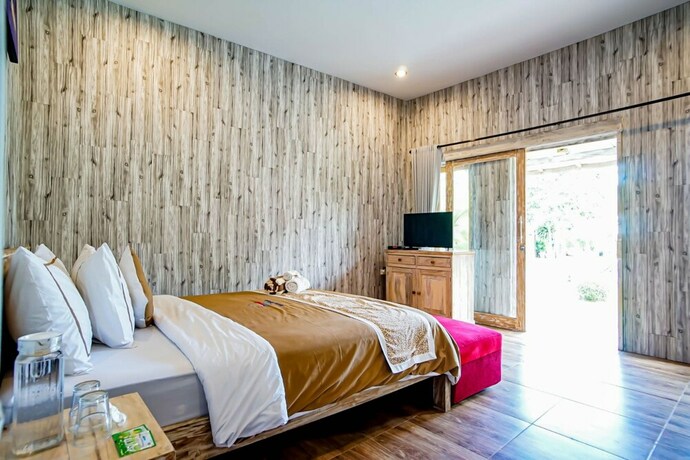 Imagen de la habitación del Hotel Agung Wiwin Homestay. Foto 24