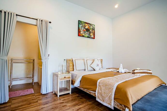 Imagen de la habitación del Hotel Agung Wiwin Homestay. Foto 25
